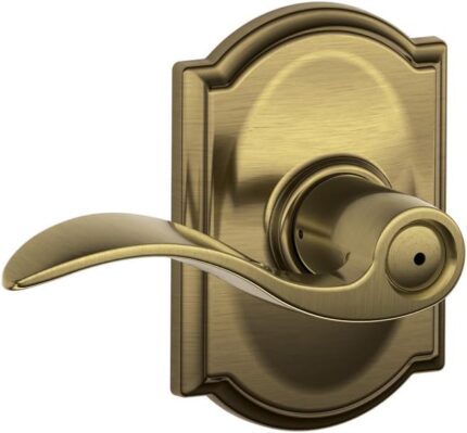 Schlage Accent Lever with Camelot Trim Bed and Bath Lock in Antique Brass - F40 ACC 609 CAM